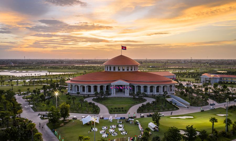 Clubhouse with the Cambodian flag at dusk