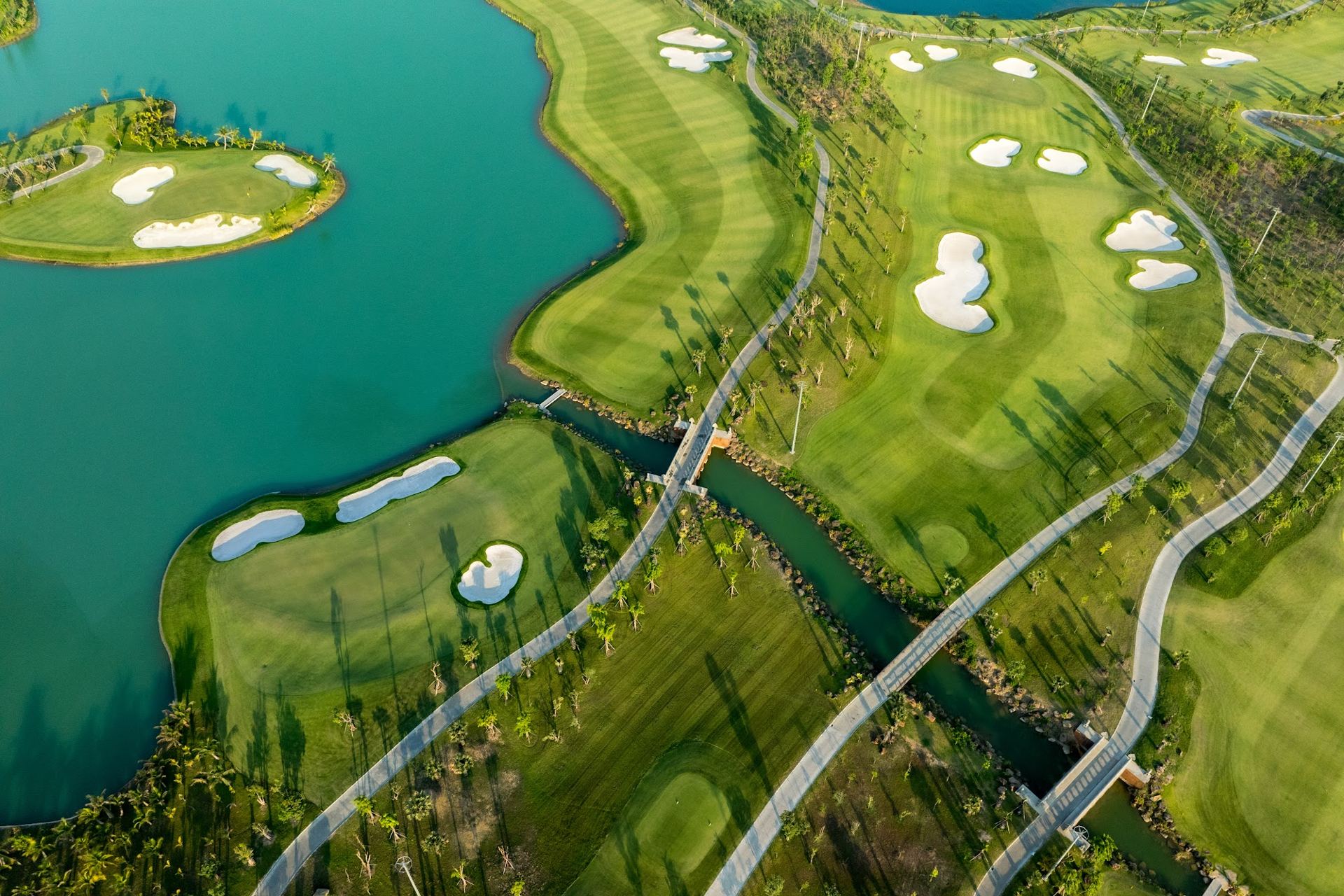 Aerial view of a lakeside golf course in Cambodia
