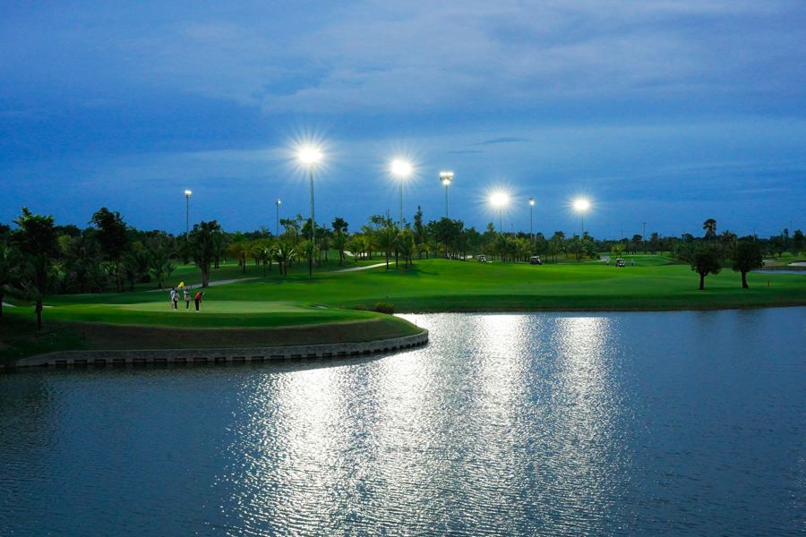 Night golf lights over the water